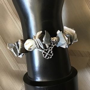 NWOT shell bracelet with charms